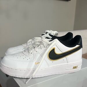 Nike White and Black Shoes with Gold Details